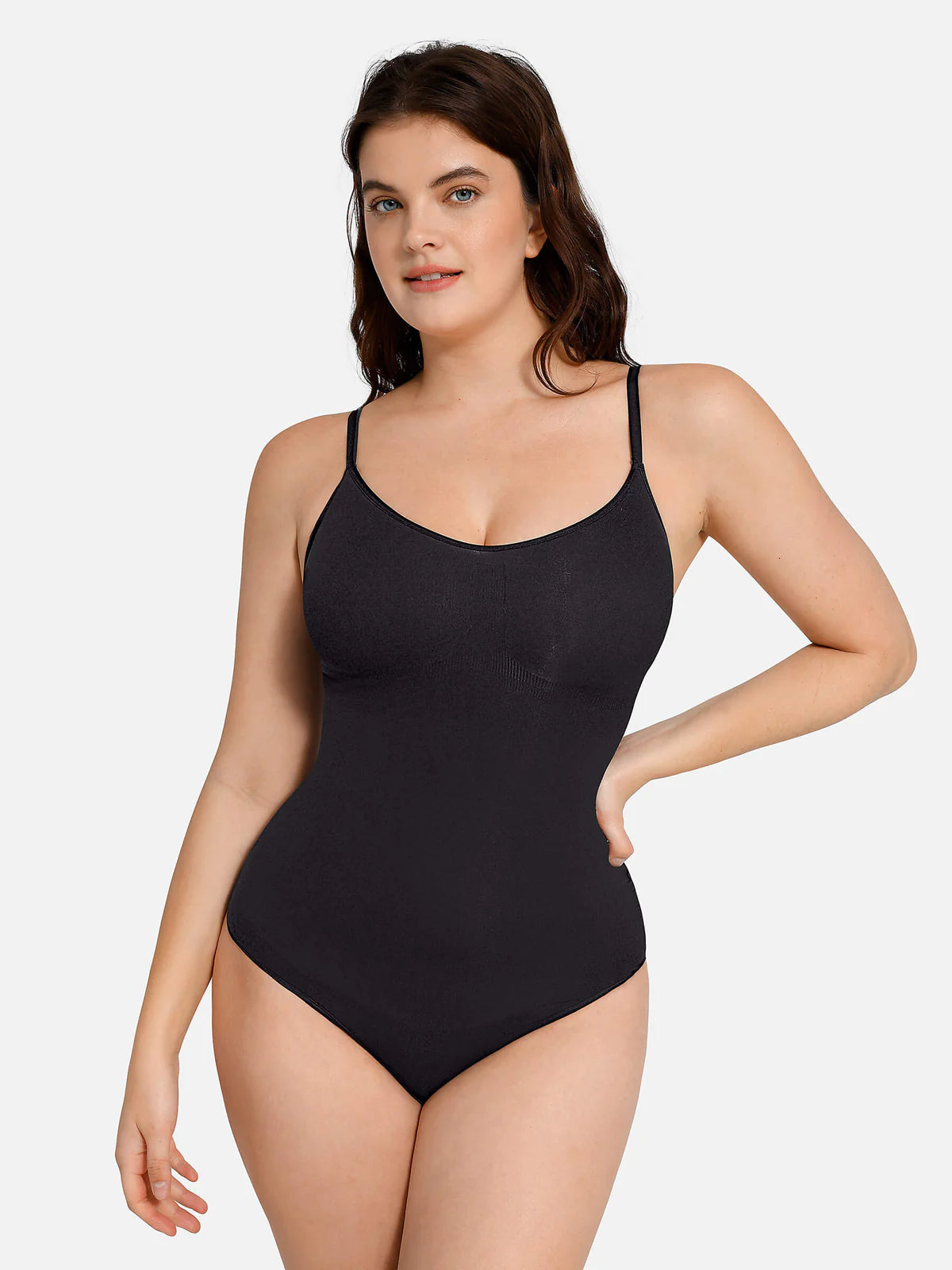 Person wearing a black shapewear bodysuit.